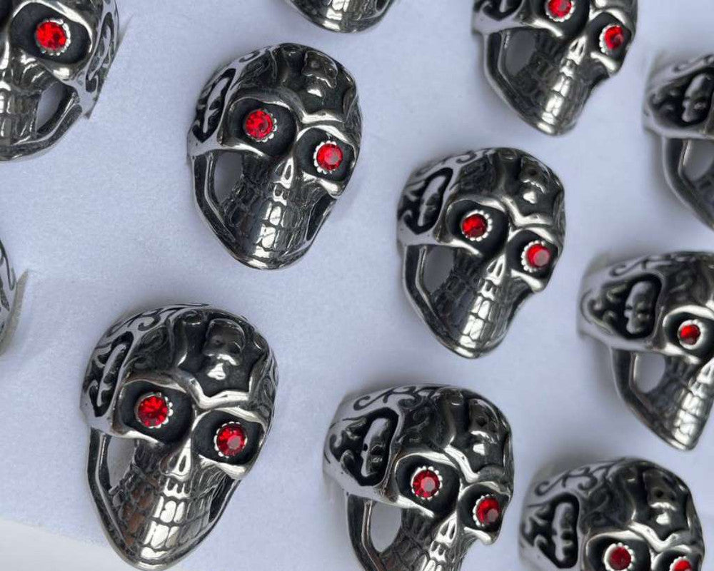 SILVER STAINLESS STEEL RED EYE SKULL RING- Set of 12